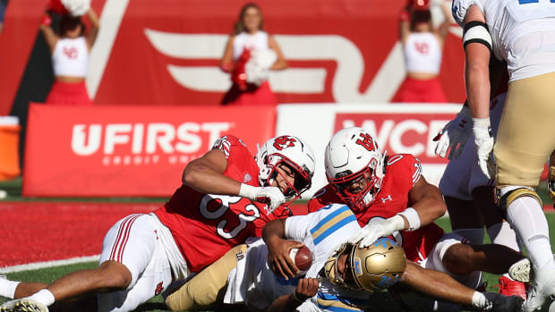 Sep 23, 2023; Salt Lake City, Utah, USA; UCLA Bruins quarterback Dante Moore (3) is sacked by Utah Utes defensive end Jonah Elliss (83) and Utah Utes defensive end Logan Fano (0) in the fourth quarter at Rice-Eccles Stadium. Mandatory Credit: Rob Gray-USA TODAY Sports 